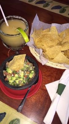 Guacamole Mexicano and a delicious frozen lime margarita.