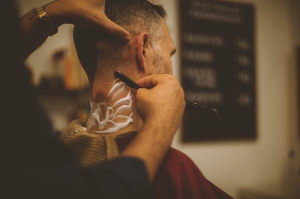 Every cut is finished with a straight razor.