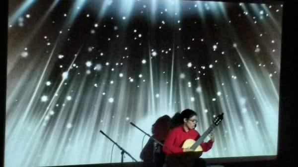 During a rehearsal for the Jewel Box series concert "Transfiguration of Dreams" (Classical guitarist Danielle Anaya is pictured.)