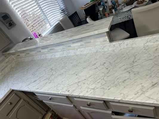 Tiled breakfast bar and painted cupboards