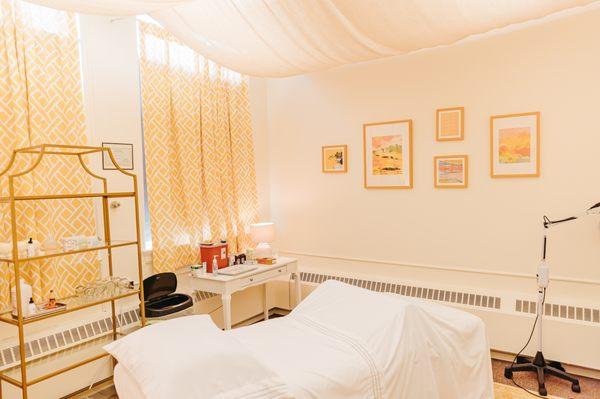 Cheerful yellow treatment room at Seneca Falls Acupuncture.