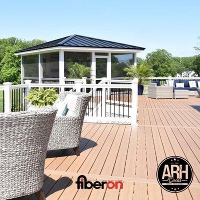 Fiberon Tuscan villa decking with metal roof pavilion.