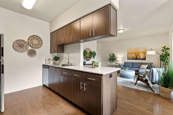 Modern kitchen with stainless steel appliances.