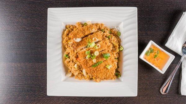 Crispy Fried Chicken over Fried Rice. Battered and deep-fried chicken fillet over specialty fried rice.