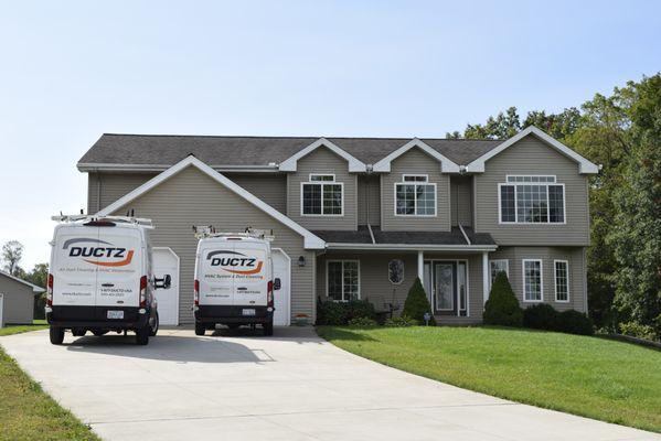 ductz vans in front of house