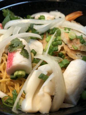 Seafood pho with egg noodles.