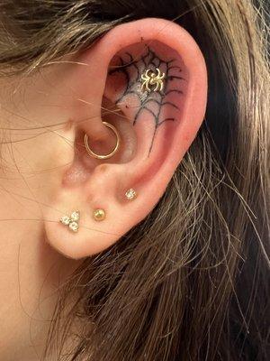 Spiderweb tattoo done by Devon 14K gold Spider flat piercing 
 Mr. Inkwells Tattoo and Piercing Shop
 #piercingshop
 #tattooshop