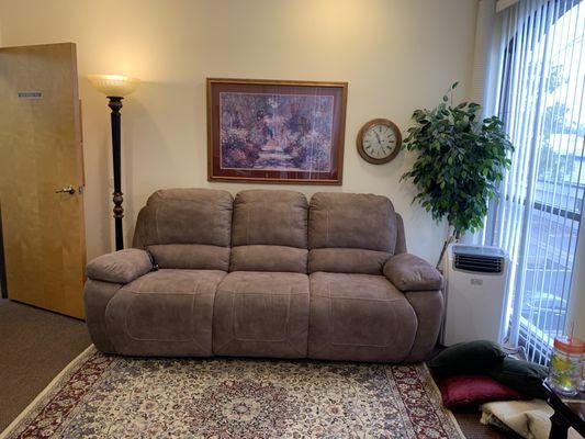 Comfortable sofa with reclining end seats.