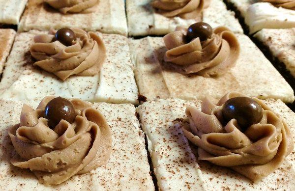 Freshly baked and decorated Mocha Bars with milk chocolate rosettes and chocolate covered espresso beans... Ready for coffee shop in Marion