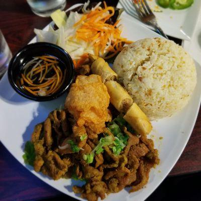 Com Dac Biet - Grilled pork, egg roll, shrimp cake, and jasmine garlic butter rice with pickled veggies and fish sauce