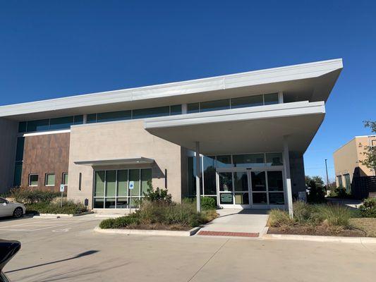 Front entrance is actually in the back. Orientation of this building seems off, but is really nice inside and out!