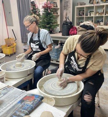 Team bonding event on the pottery wheel.