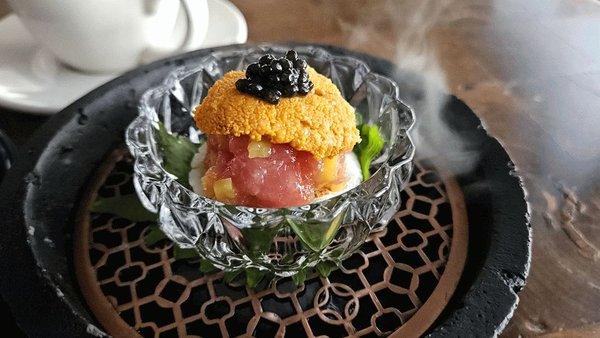 Omakase tuna, uni and black caviar on a scallop