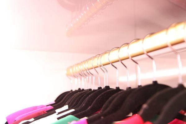 Gold clothing rack at Tres Chic boutique