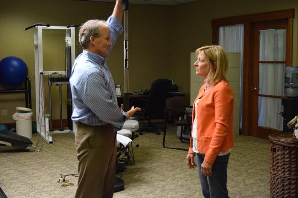 Dr. Ambridge helping a patient learn how to use a Palo Stick