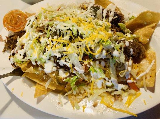 Carnitas Nachos. Home made chips, layered for optimal flavor and texture... So deliciousness.