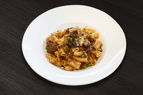 Braised Short Ribs Rigatoni: Mushrooms, onions, green peas. and demi-glace  sauce.