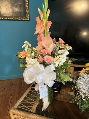 Deluxe sympathy arrangement in white & peach.