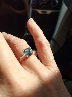 Montana Sapphire (2.1ct) with a baguette diamond in each side.