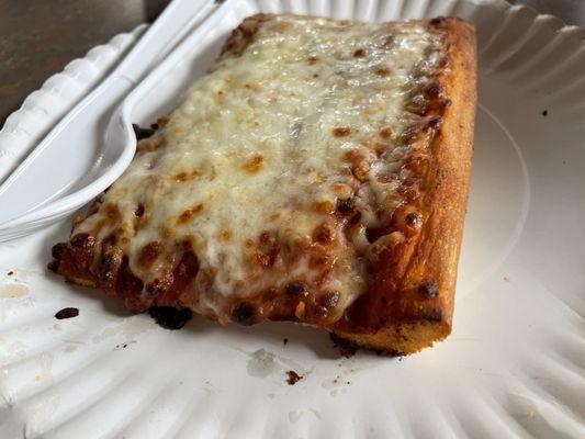 Old school sheet pan pizza on a paper plate. The Rebel way!