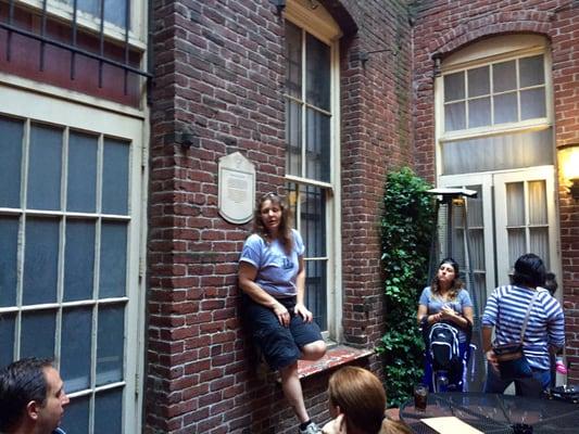 Tour Guide in the Courtyard of Hobo's Restaurant where the Shanghai Tunnels Tour Begins