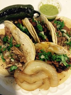 Tacos, grilled jalapeño, grilled onions, and avocado salsa. So freaking good! Try the carnitas! ;)