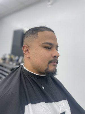 Mid skin fade with line up by Charles Kaukeano