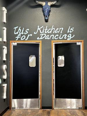 Kitchen doors - love the signs.