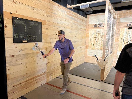 Try some axe throwing trick shots!