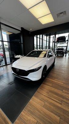 2023 Mazda3 2.5T AWD Hatchback in the show room of Tom Bush Mazda.