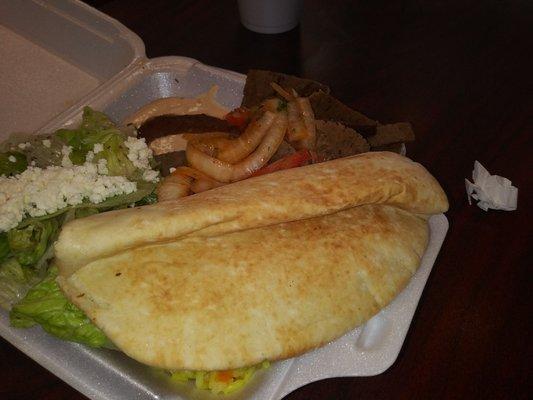 Gyro Plate with hummus, rice and feta salad. The picture does not do this justice ... Very large portion and incredibly tasty !