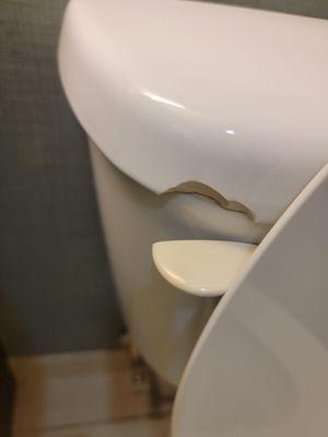 Cracked lid for toilet tank.