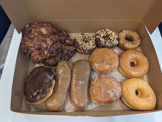 One dozen donuts with upcharge for apple fritters for total of twenty three dollars