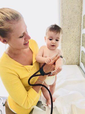 Dr. Zak and our little nugget at a checkup :) all smiles !