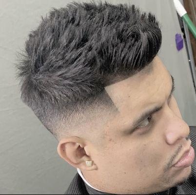 High skin fade with textured fohawk