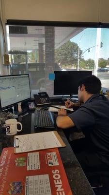 Murad putting together an estimate for one of our client's vehicles.