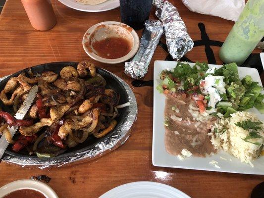 Shrimp and chicken fajitas. Very good. Skimpy fixings plate though there is a tiny bit missing from this one