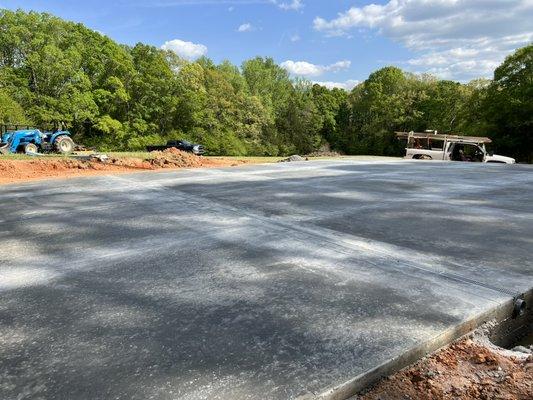 40x50' build slab with a slick finish and double drains.