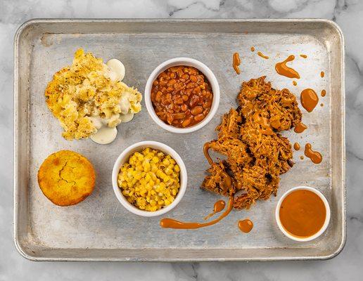 Pork shoulder smoked and shredded, topped with Rick's Carolina barbeque sauce and paired with southern-style cornbread sauce