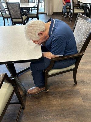 My husband being allowed to sleep at the dining table.