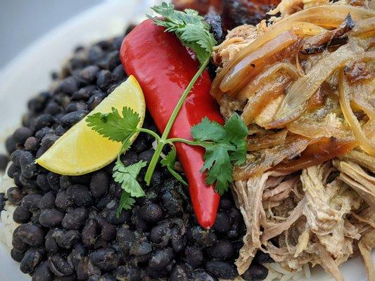 Platos - Lechon - roasted mojo pork, black beans & rice, and maduros.