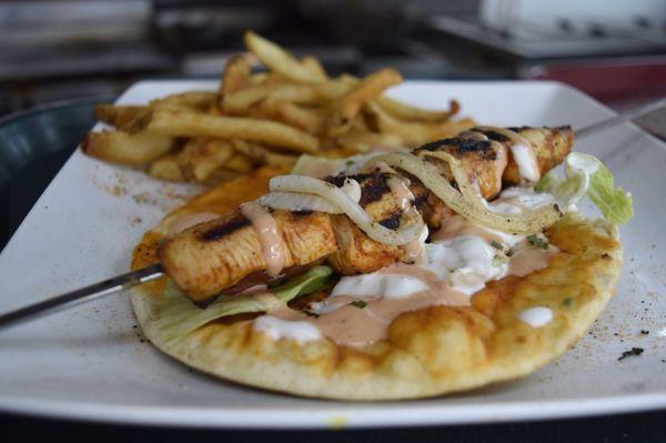 Chicken skewer on pita