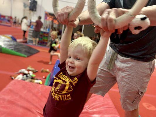 Trying out the rings for the first time. Gymcats introduces kids of all ages to the best equipment!