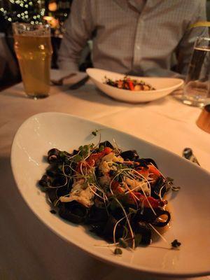 Squid Ink Pasta and Lobster split into two portions.