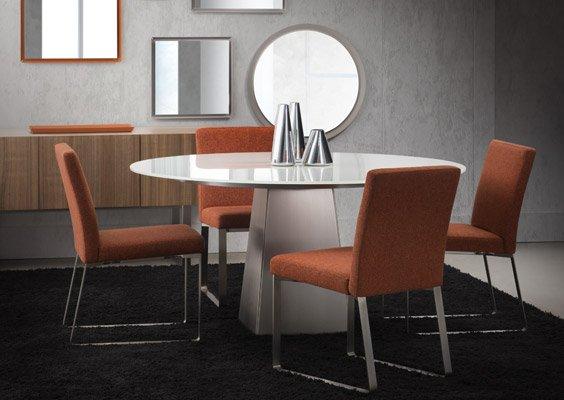 Contemporary Canadian dinette. Round glass table with metal pedestal base