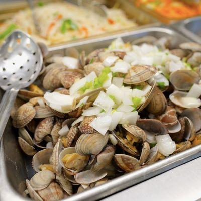 Sautéed Baby Clams with Onion, a favorite on our buffet. It's a simple, tasty mix of tender clams and sweet onions - a seafood delight!