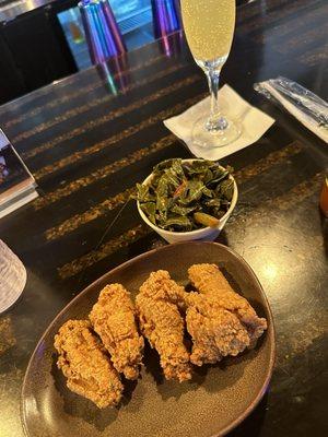 Chicken wings, greens, pineapple mimosa