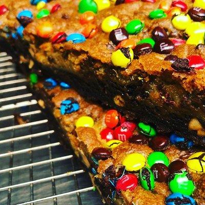 Double layer of Choc Chip & choc pb cookie cake with M&M's! Customize your own celebration cookie cake today!