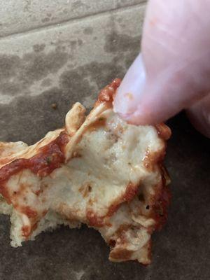 Very undercooked pizza