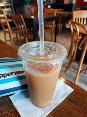 Iced decaf with coconut milk and raw sugar.